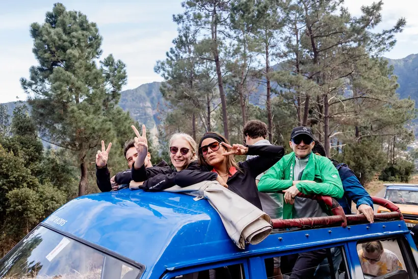 Founders waving from the roof of a jeep in Madeira’s mountains