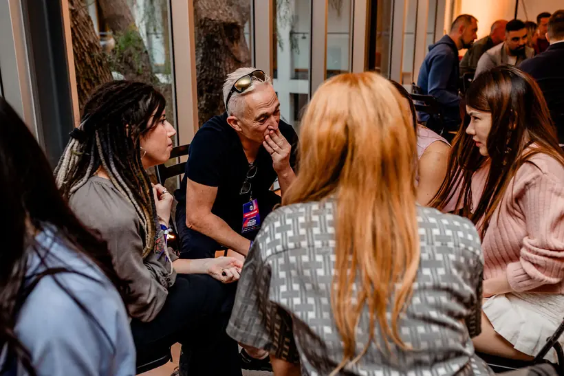A small mastermind group in deep conversation