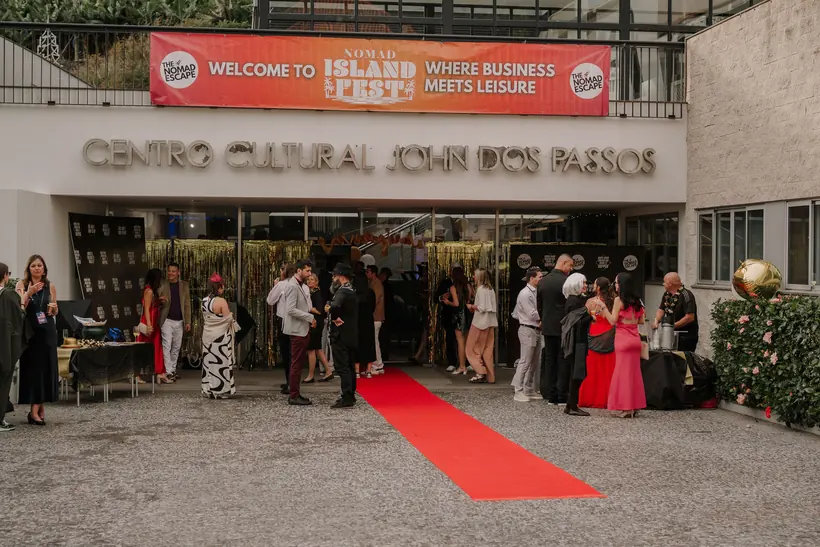 The red carpet and welcome banner outside the opening-night venue
