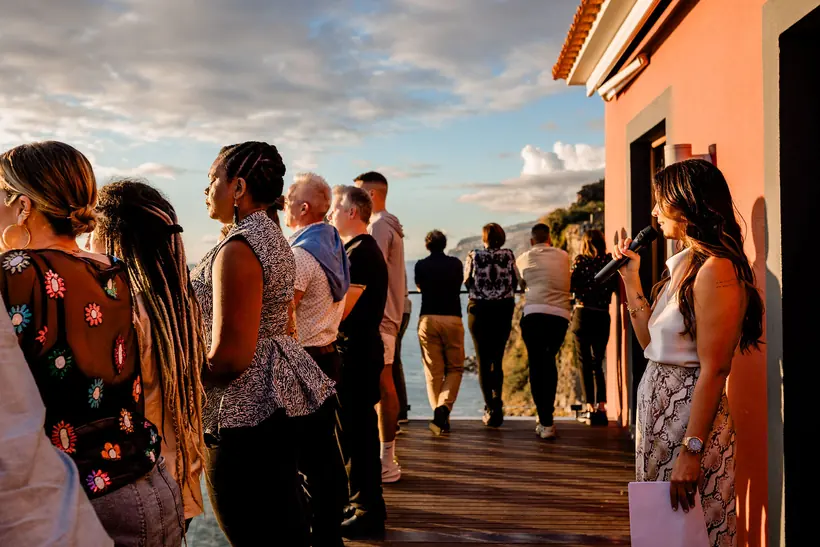 Founders talking on a terrace at sunset